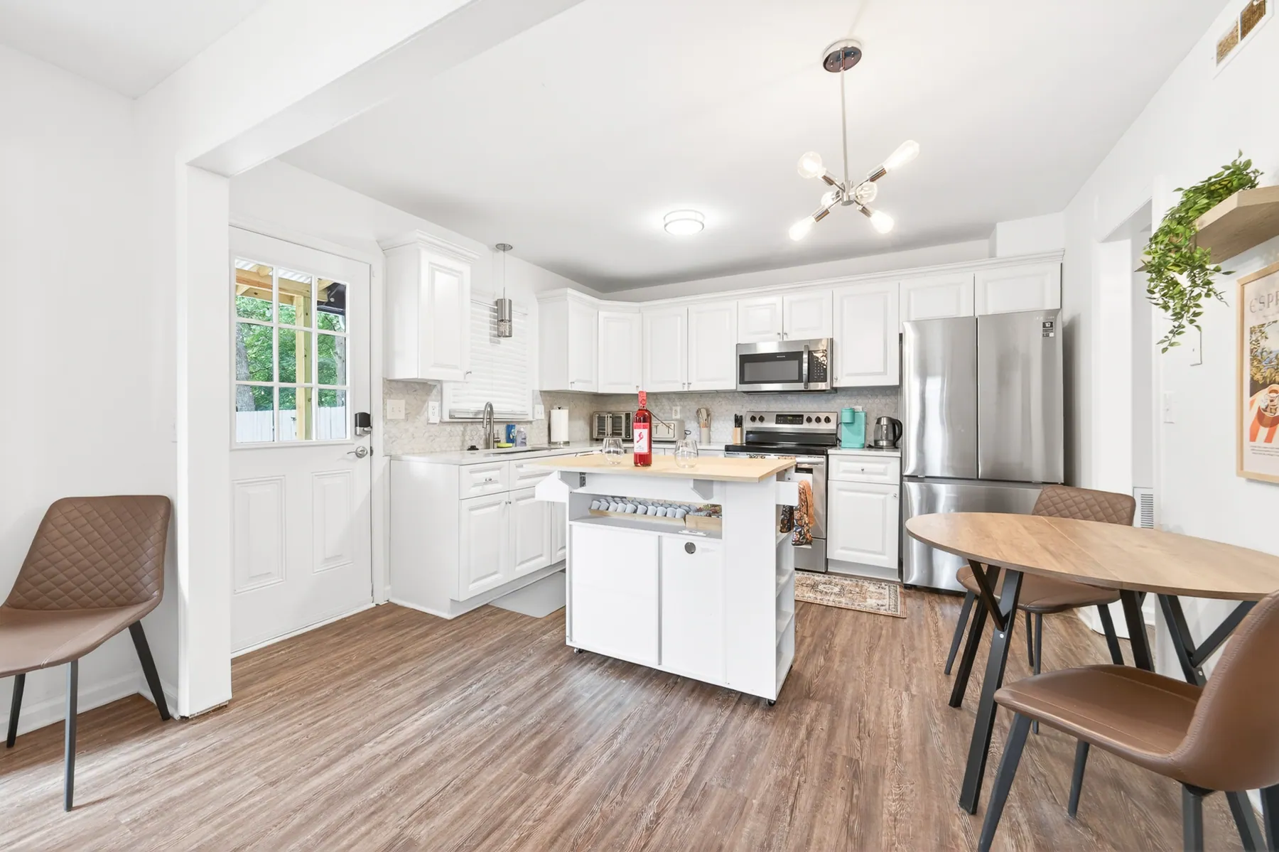 Bright WEX furnished rental kitchen and dining area
